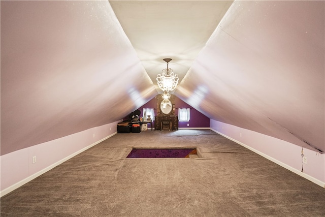 additional living space featuring a notable chandelier, lofted ceiling, and carpet floors