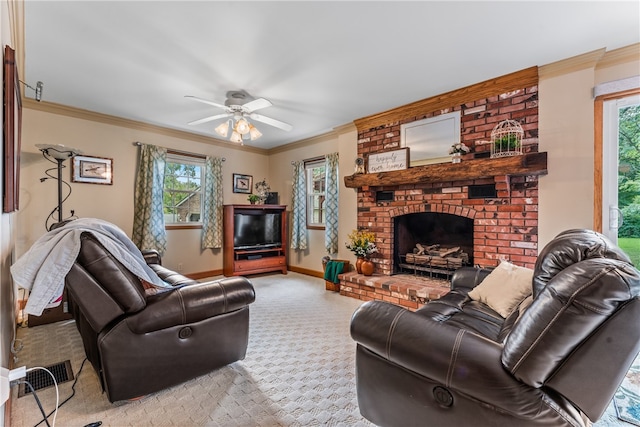 carpeted living room with brick wall, a fireplace, ceiling fan, and ornamental molding