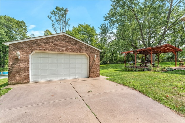 garage featuring a lawn