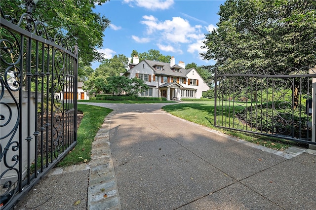 view of gate with a yard