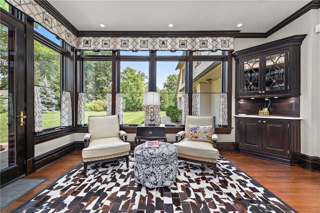 interior space featuring dark hardwood / wood-style flooring and crown molding