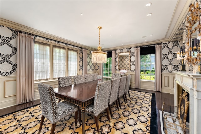 dining room featuring crown molding and light hardwood / wood-style flooring