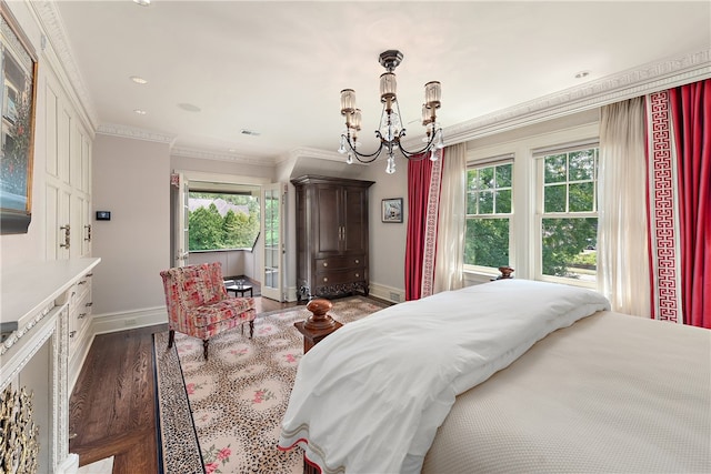 bedroom featuring crown molding, wood-type flooring, and a notable chandelier