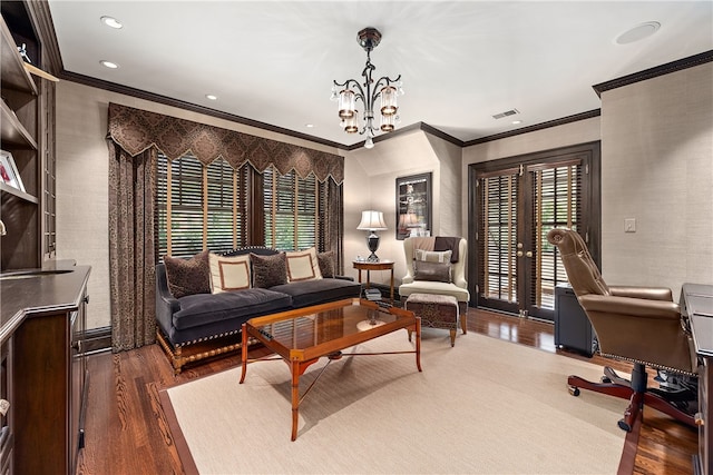 living room featuring an inviting chandelier, dark wood-type flooring, french doors, and ornamental molding