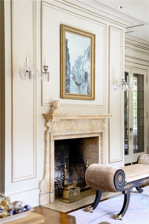 details with a high end fireplace and french doors