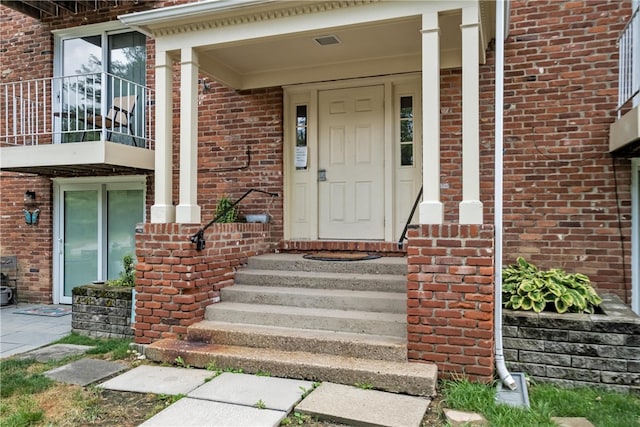 doorway to property featuring a balcony