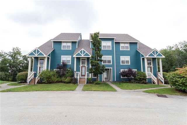 9133 Aspen Dr, Seven Springs Resort, PA 15622 - townhome / multi-family property featuring a front lawn and a shingled roof