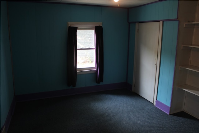 unfurnished bedroom with a closet and carpet floors