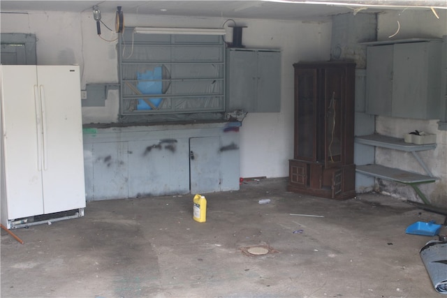 garage with white fridge