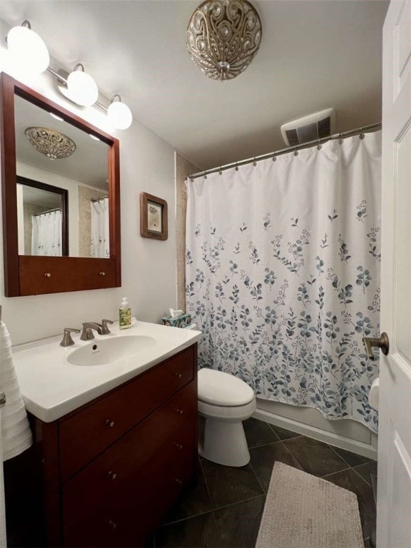 full bathroom with tile patterned floors, shower / bathtub combination with curtain, toilet, and vanity