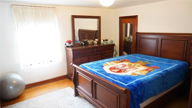 bedroom with light hardwood / wood-style flooring