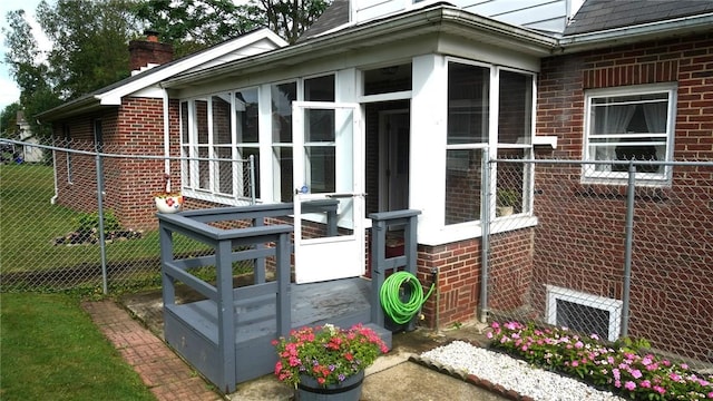 view of side of property with a sunroom