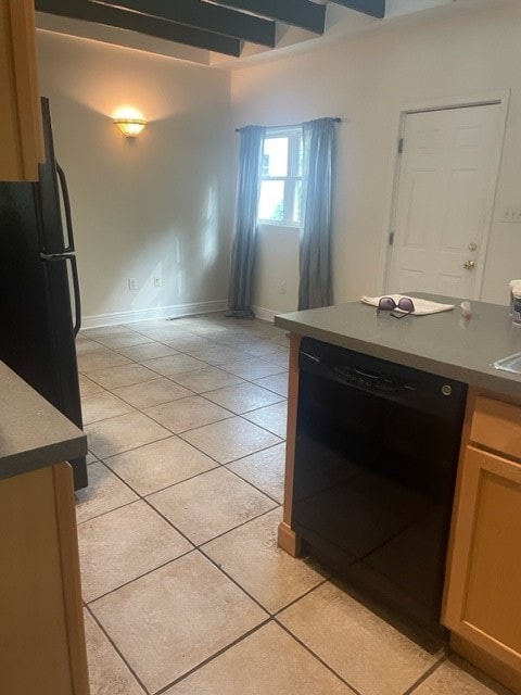 kitchen with black appliances, light brown cabinets, and light tile patterned floors