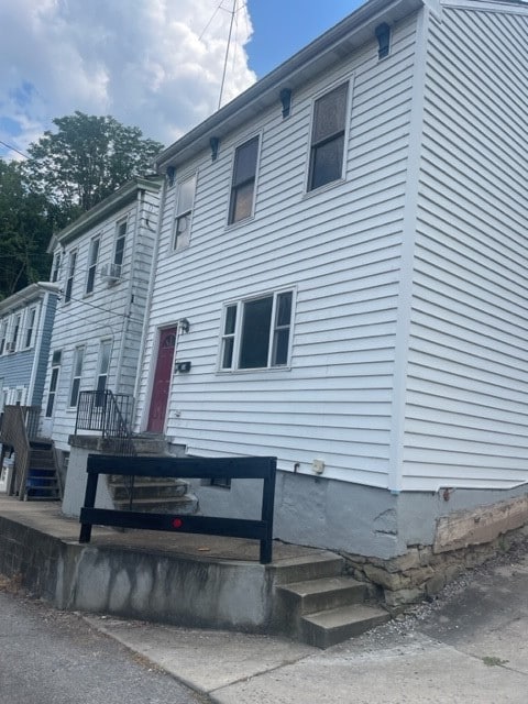 back of house featuring a deck