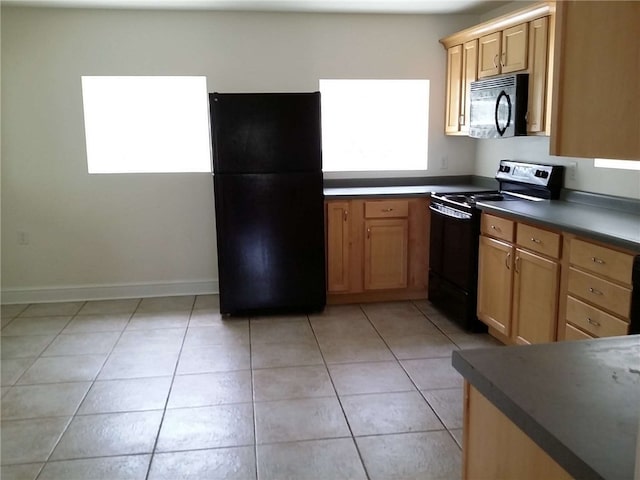 kitchen with black appliances and light tile patterned floors