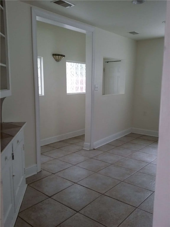 interior space featuring light tile patterned flooring