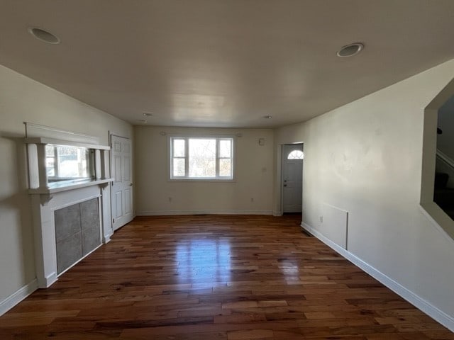 spare room with dark hardwood / wood-style flooring