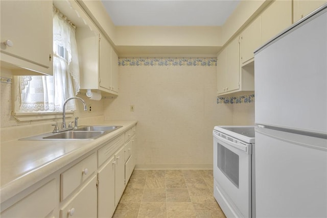 kitchen with a sink, baseboards, white appliances, and light countertops