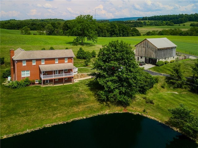 aerial view with a rural view and a water view