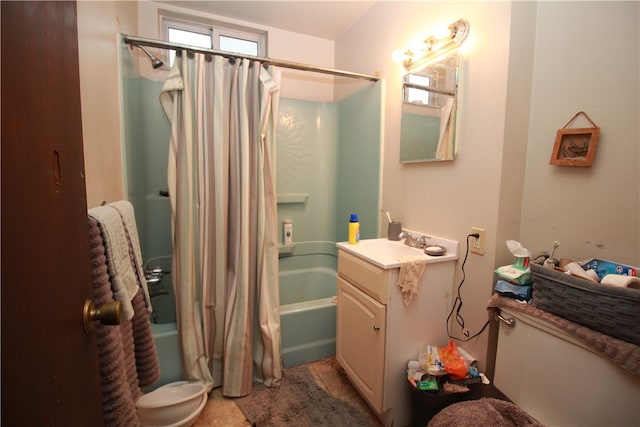 full bathroom with a wealth of natural light, vanity, toilet, and shower / bath combo