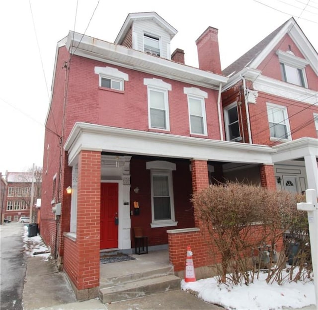 view of front of house with brick siding