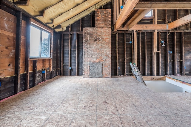 miscellaneous room with sink and vaulted ceiling