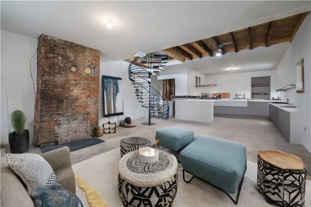 living room with beamed ceiling