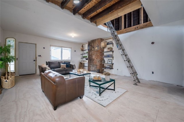 living room with beamed ceiling