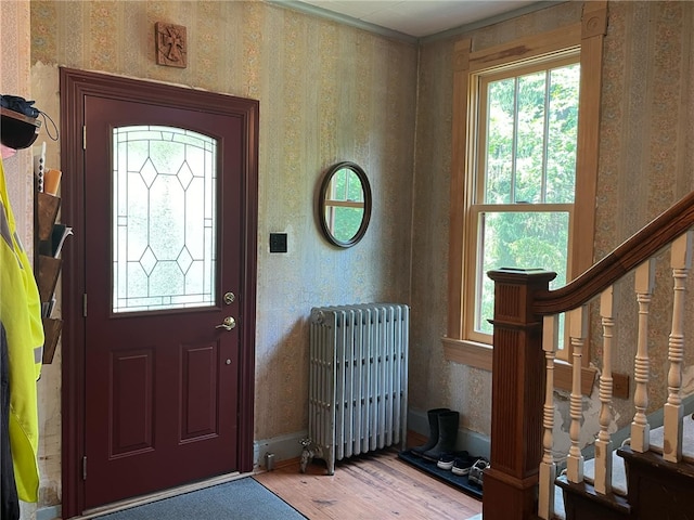 340 Mine Hill Rd, German Twp, PA 15410 - foyer entrance with radiator heating unit, wood finished floors, and a healthy amount of sunlight