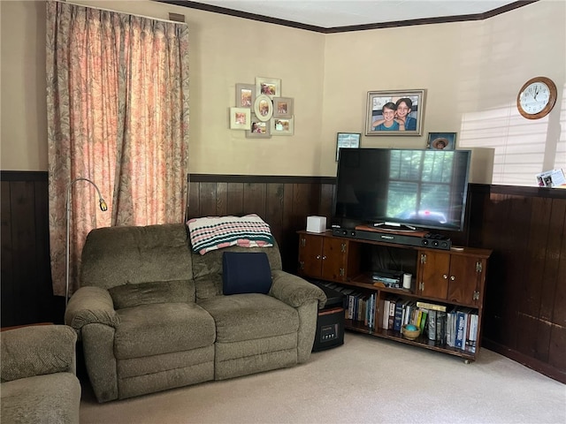 carpeted living room featuring ornamental molding