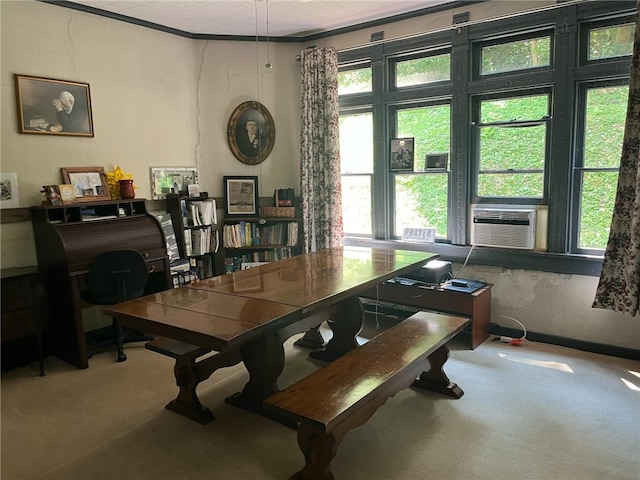 dining area with cooling unit, crown molding, and carpet