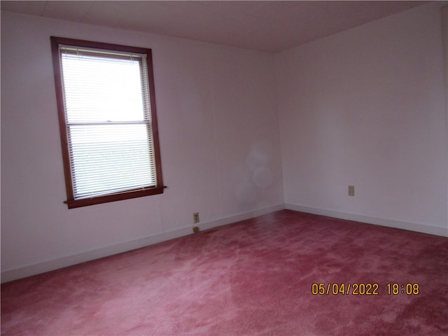 unfurnished room with carpet