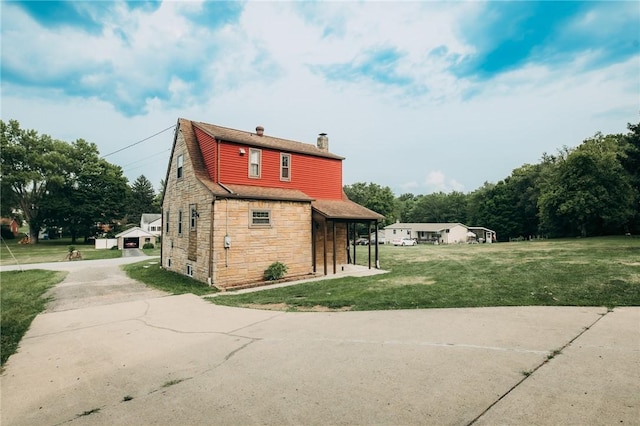 view of side of property with a yard