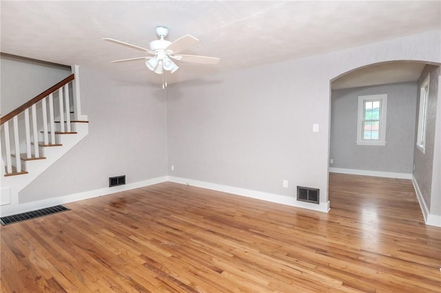 unfurnished living room featuring ceiling fan and light hardwood / wood-style floors