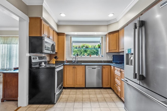 kitchen with sink, appliances with stainless steel finishes, and crown molding