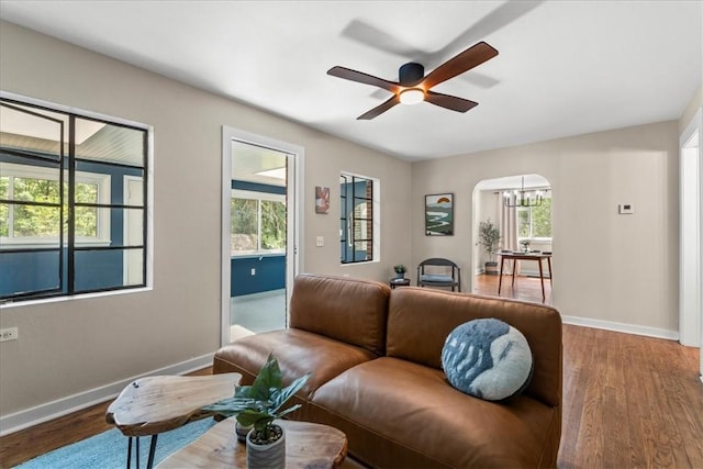 living room featuring hardwood / wood-style flooring and ceiling fan