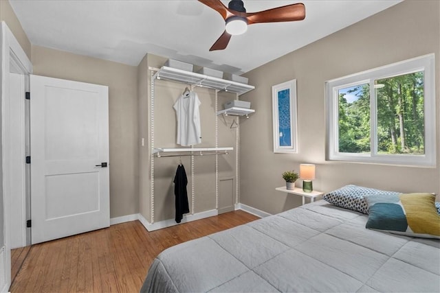 bedroom featuring hardwood / wood-style floors and ceiling fan