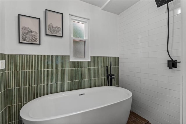 bathroom featuring tile walls, wood-type flooring, and plus walk in shower