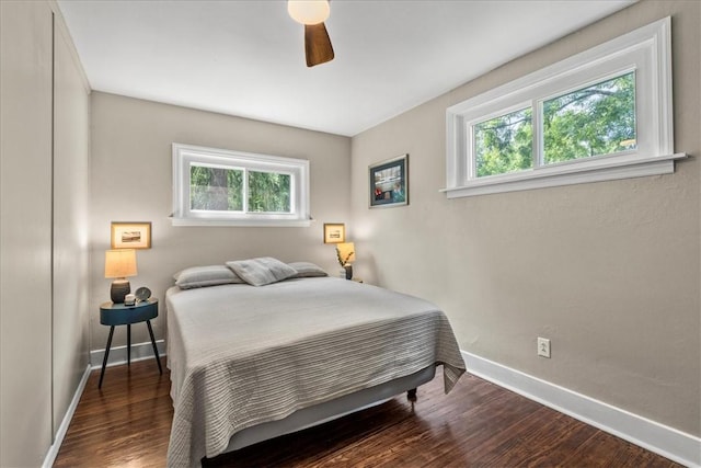 bedroom with hardwood / wood-style flooring and ceiling fan