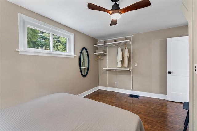 bedroom with ceiling fan and wood-type flooring