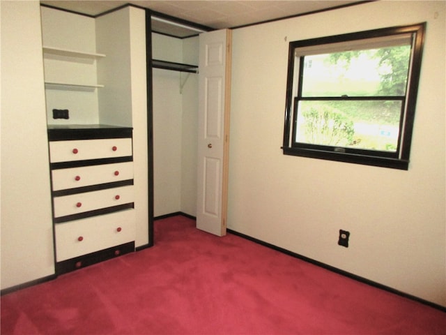 unfurnished bedroom featuring dark carpet