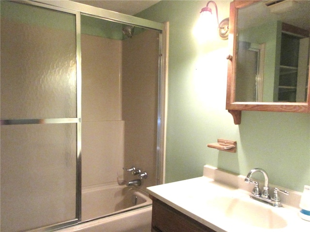 bathroom with enclosed tub / shower combo and vanity