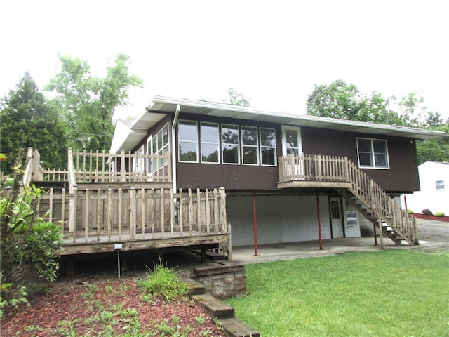 back of property with a wooden deck