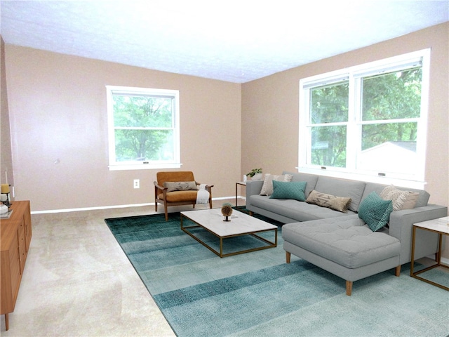 living room with a healthy amount of sunlight and carpet flooring