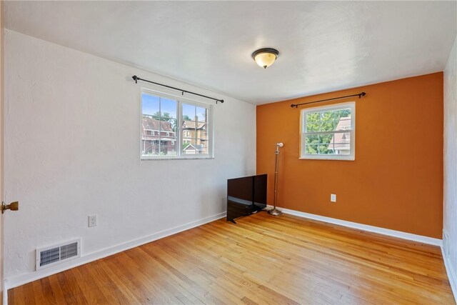 empty room with light wood-type flooring