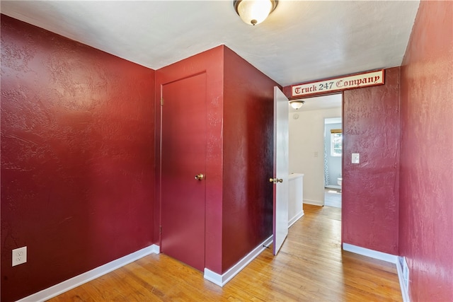 corridor featuring light wood-type flooring