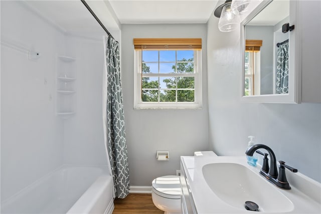 full bathroom with wood-type flooring, vanity, toilet, and shower / bath combo