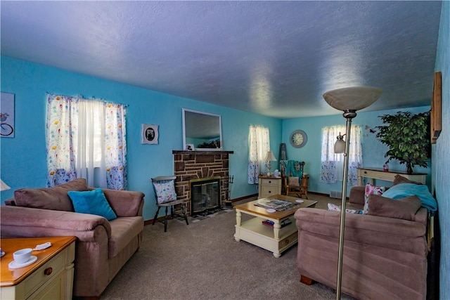 living room with carpet flooring, a fireplace, and a textured ceiling