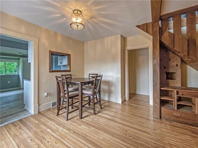 dining space featuring light hardwood / wood-style flooring