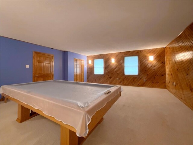 recreation room with wooden walls, carpet flooring, and pool table